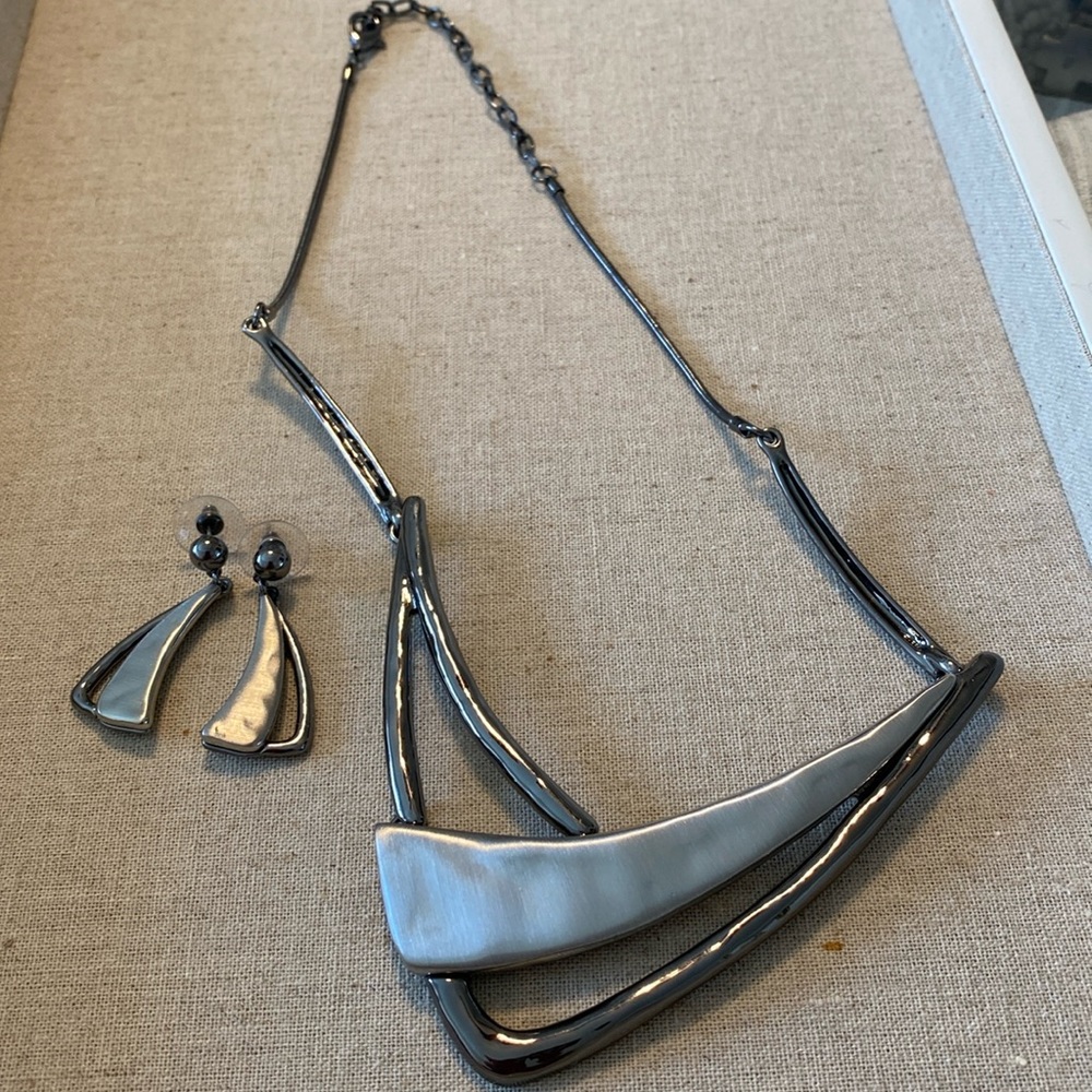 A perfect match! Silver tone necklace and earring set.